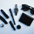 A pocket dump flatlay of minimalist, all-black EDC gear