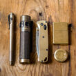 EDC flatlay of brass gear